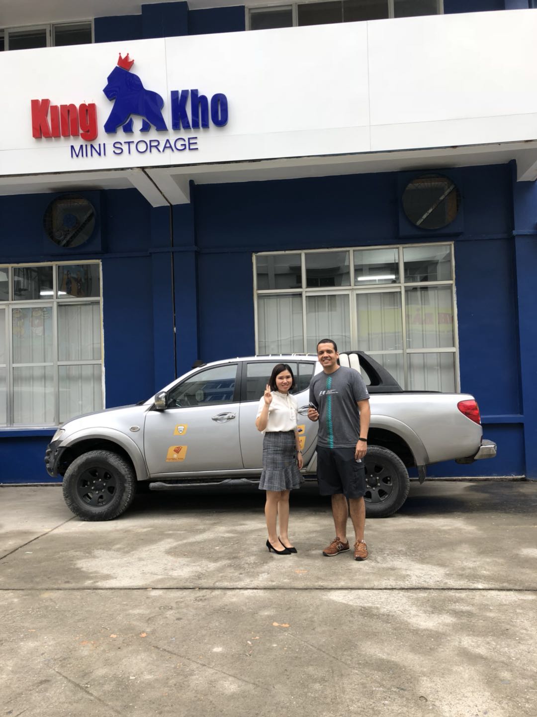 Self Storage Facility Manager Ms Ly posing with KingKho Hano's First Customer